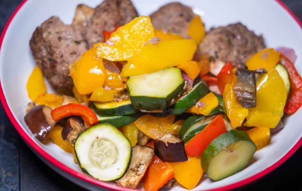 make vegetable and sausage stir fry with camping kettle